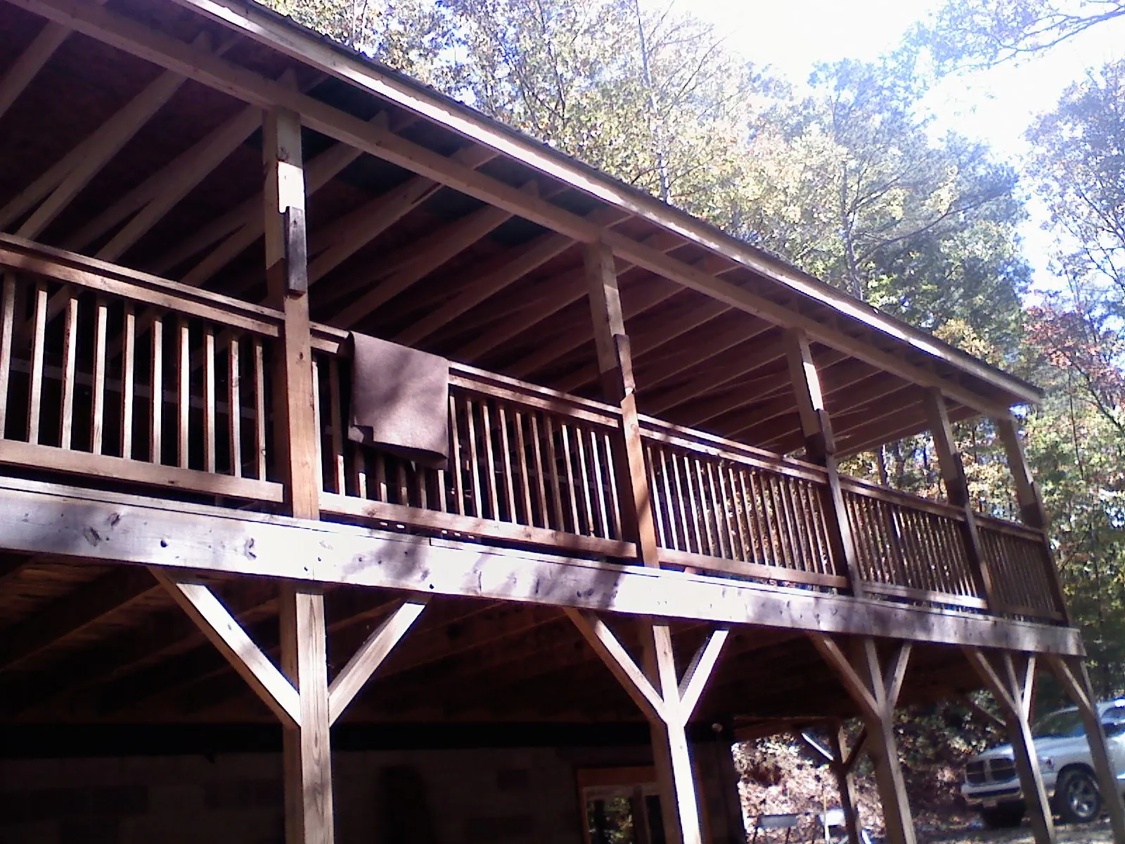 Timber framing under a new elevated porch and deck — Roof Leak Repair in North Haverhill by Roofing Brothers